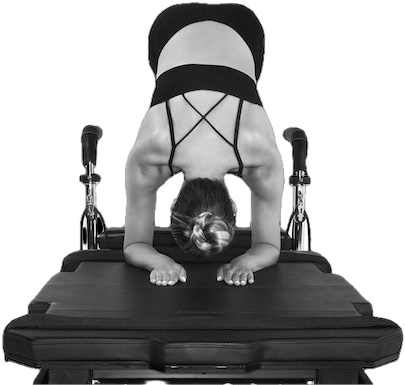 Woman stretching on a pilates reformer